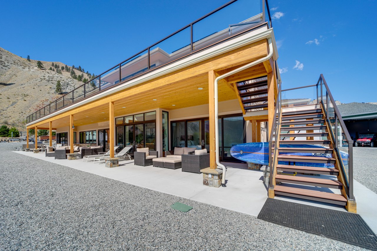 Multiple areas with outdoor seating and 2 paddleboards