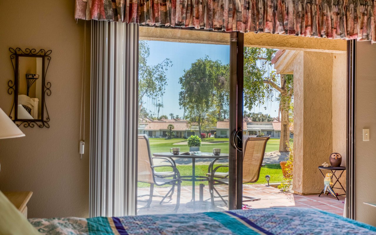 King bedroom with patio access