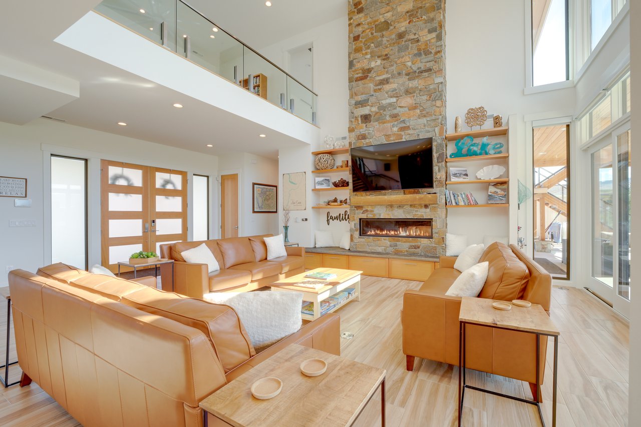 Open concept Living Room with stone Propane Fireplace