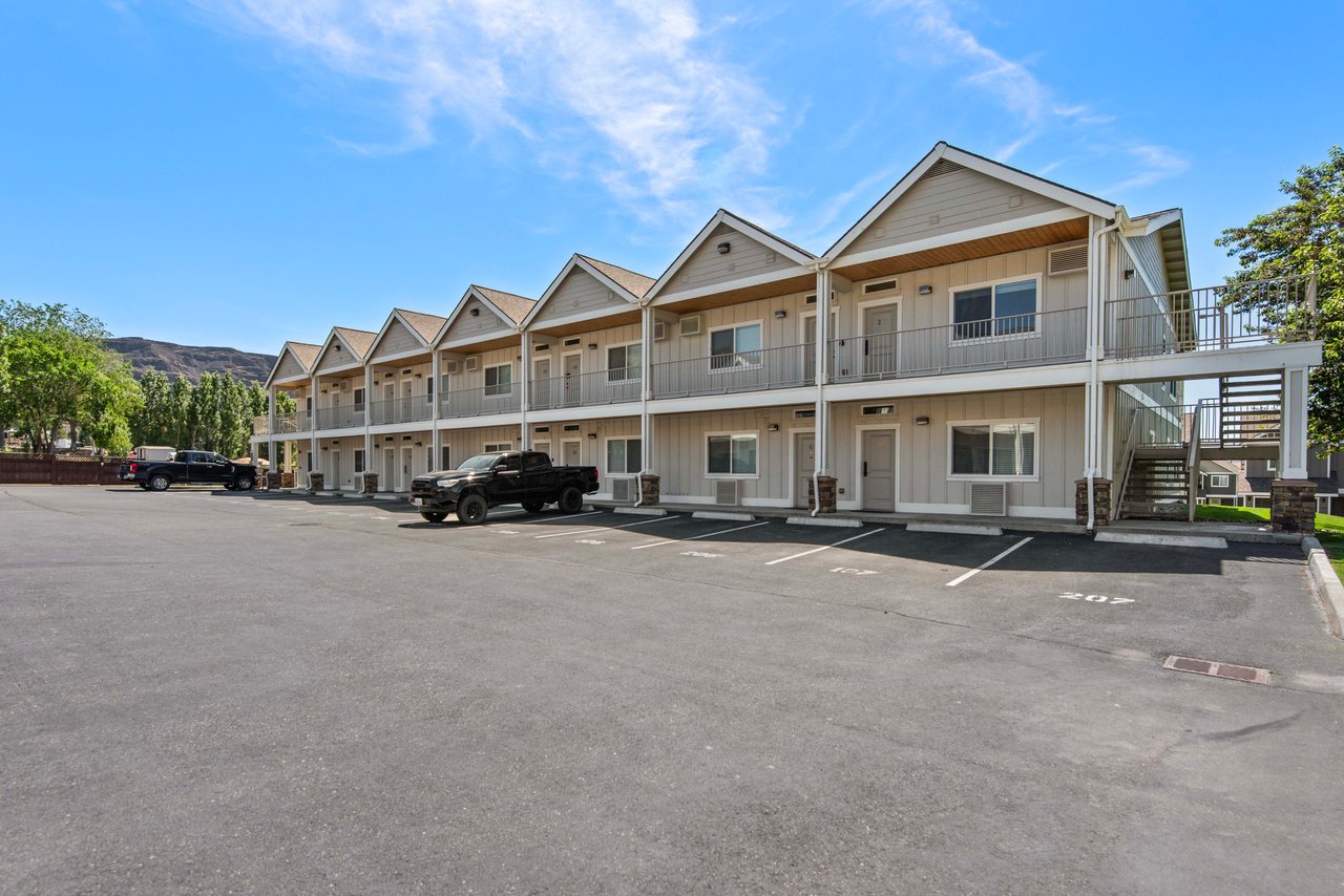 Crescent Bay Condos Complex Exterior. One Designated Parking Spot for Unit.