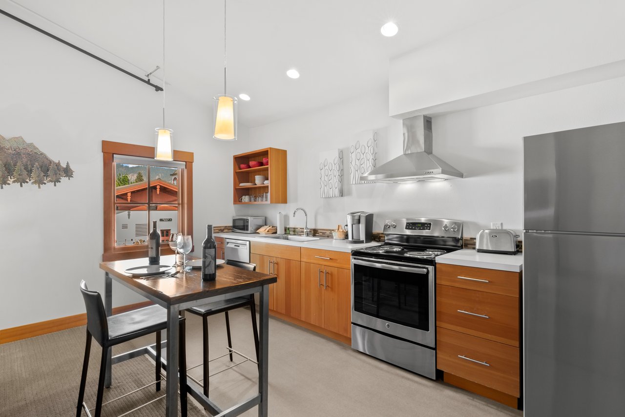 Kitchen with Dining Area and Stainless Appliances.