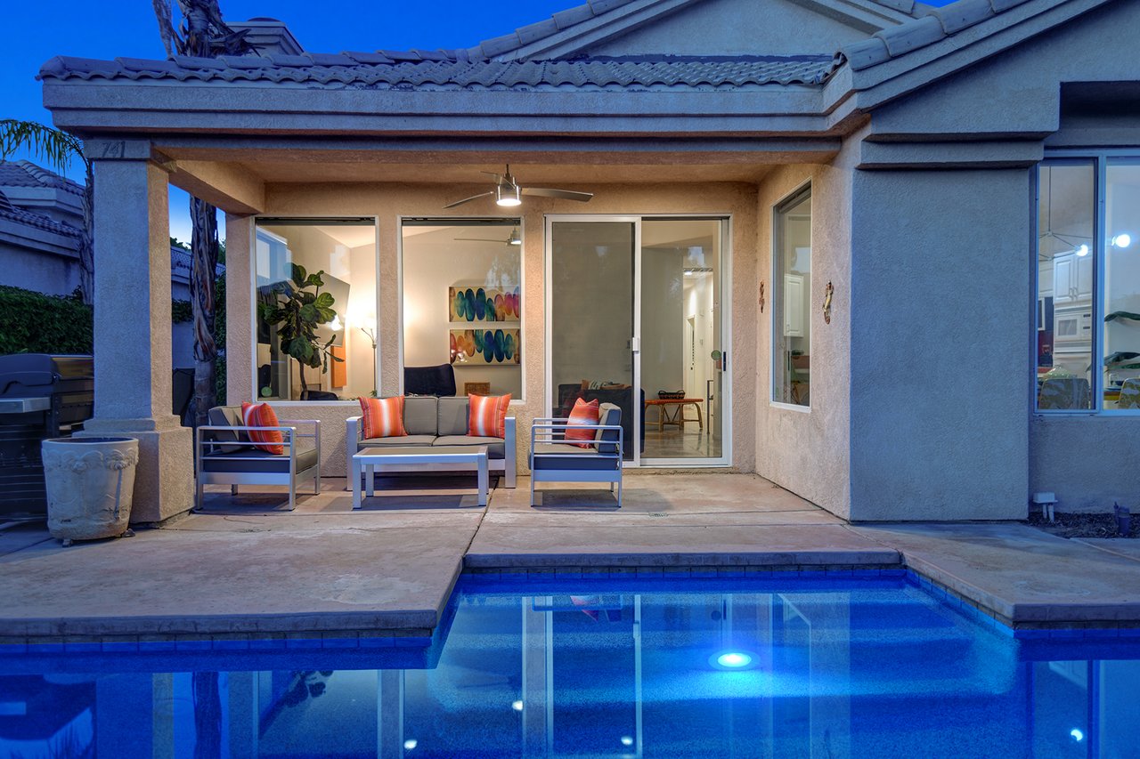 NIGHT BACK OF HOME TIGHT OVER POOL