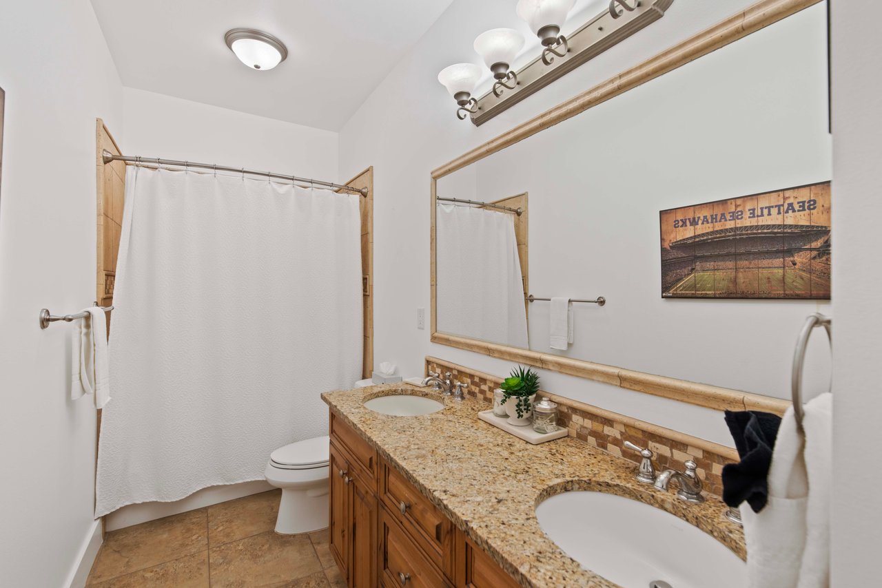 Full Bathroom with double sinks, Bathtub & Shower