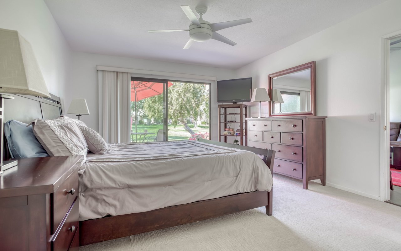 King bedroom with TV and Dresser