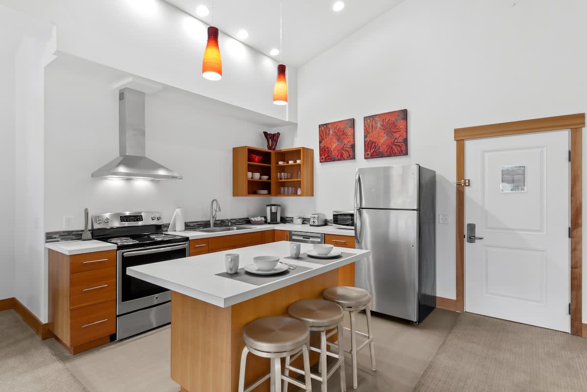 Kitchen with Stainless Steel appliances and eating area.