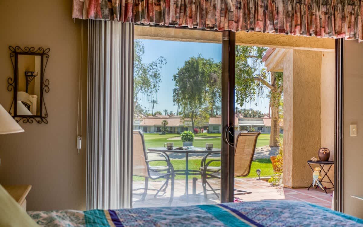 King bedroom with patio access